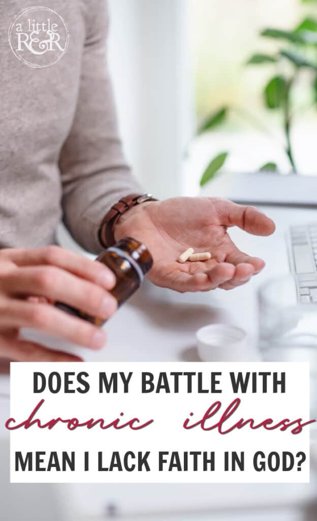 Person sitting at desk with pills in their hand