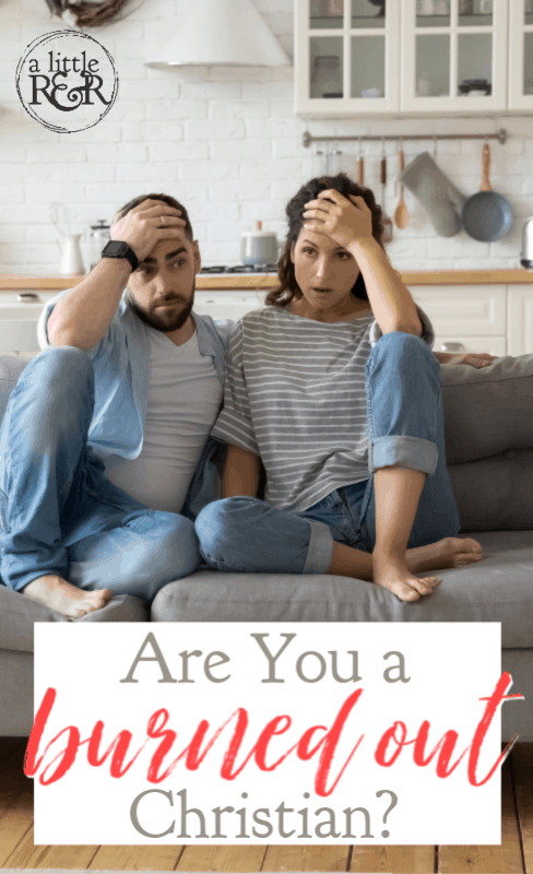 man and woman sitting on couch tired