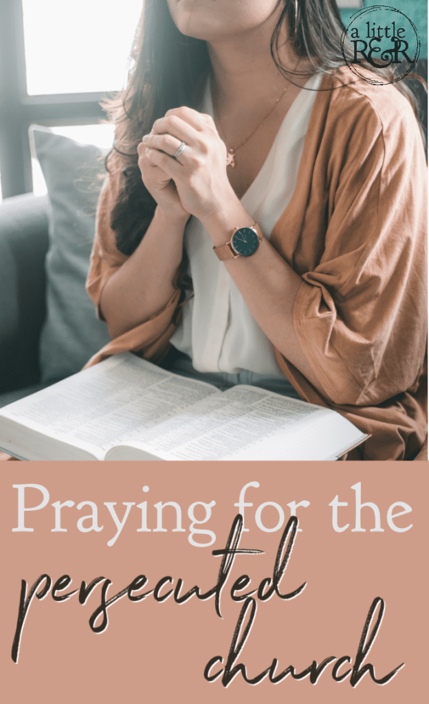 lady in brown sweater with hands folded, Bible on lap, praying