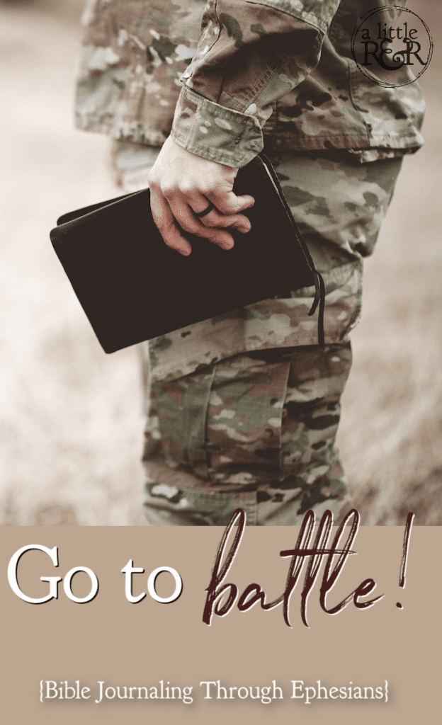soldier in fatigues holding Bible