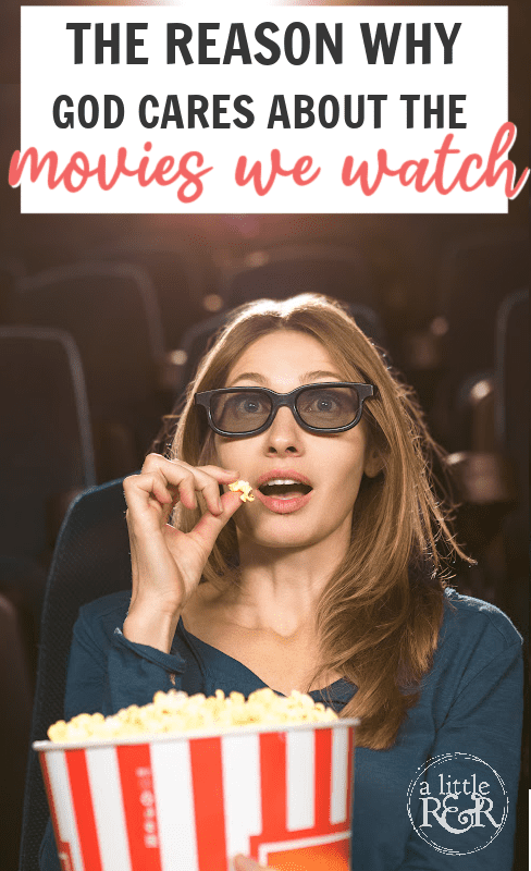 woman watching a movie in theater eating popcorn