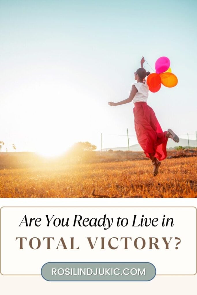 woman with baloons ready to live in victory
