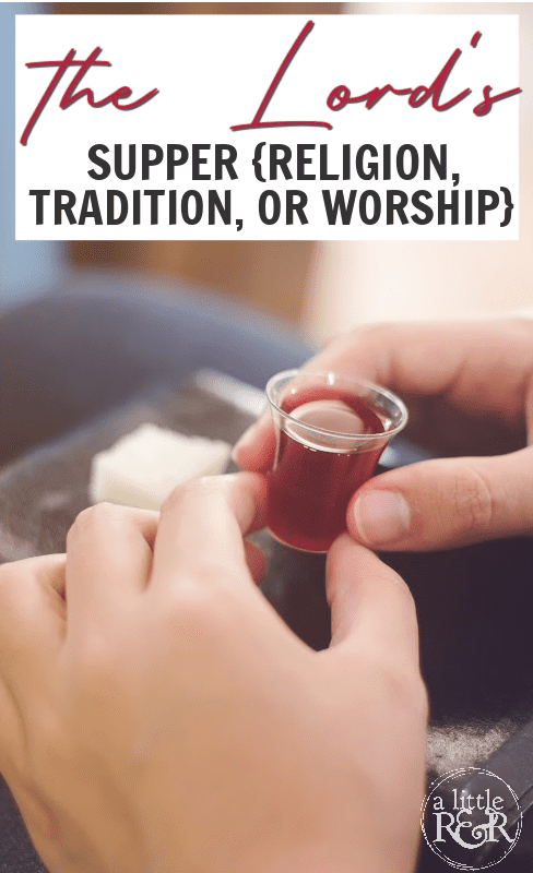 Person holding communion elements with a Bible resting on their lap