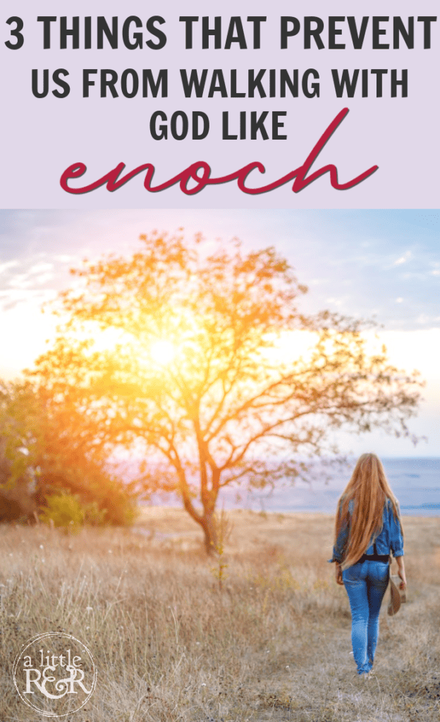 Woman walking grassy path to ocean in sunset