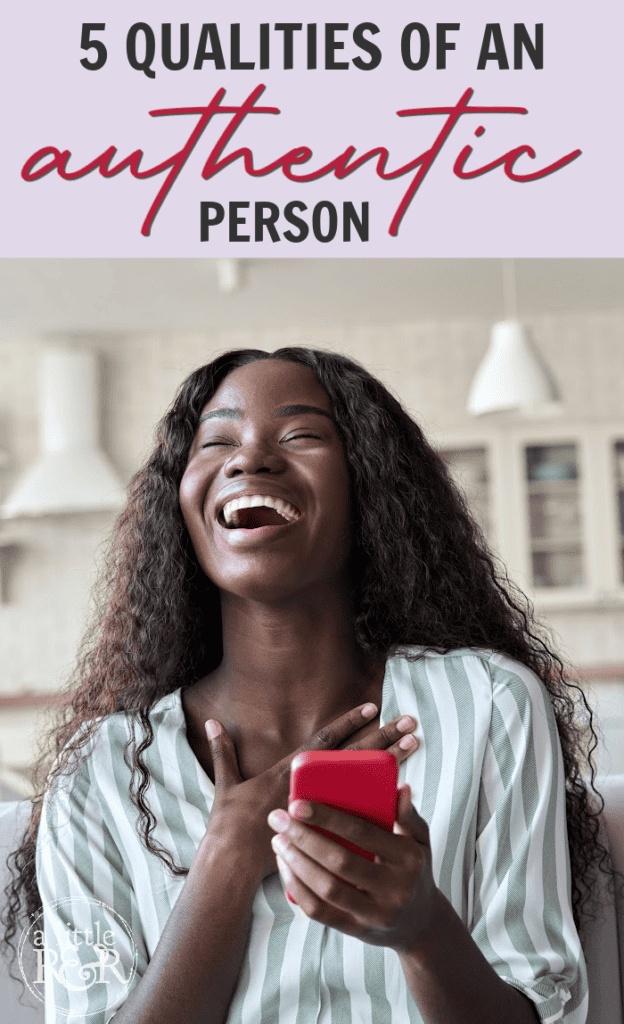 Woman laughing and talking on red cell phone