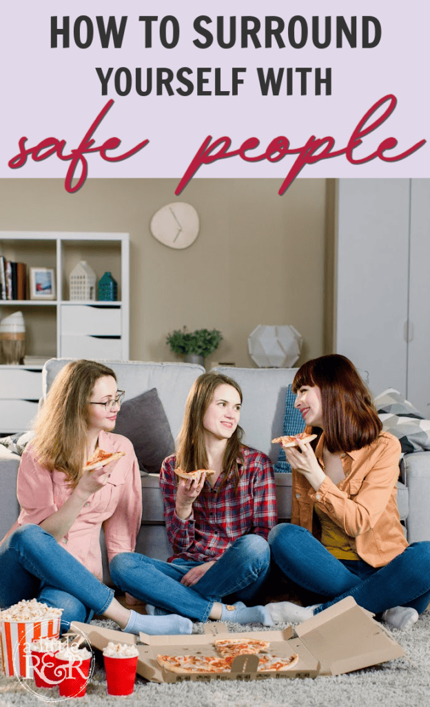 three women sitting on floor eating pizza and popcorn