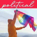 man holding an LGBTQIA rainbow flag
