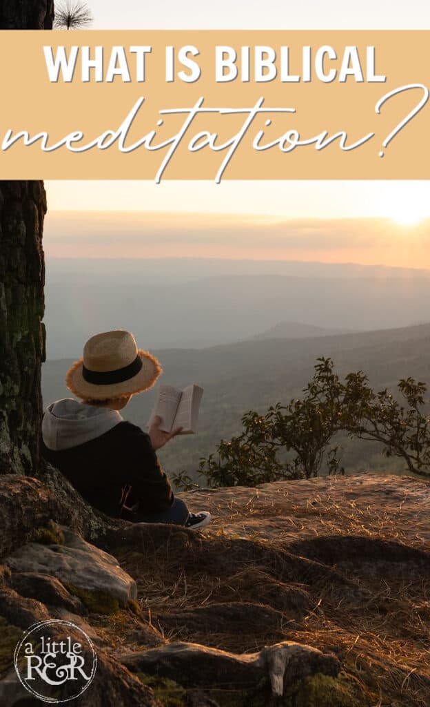 person in hat sitting against a tree at sunset reading Bible