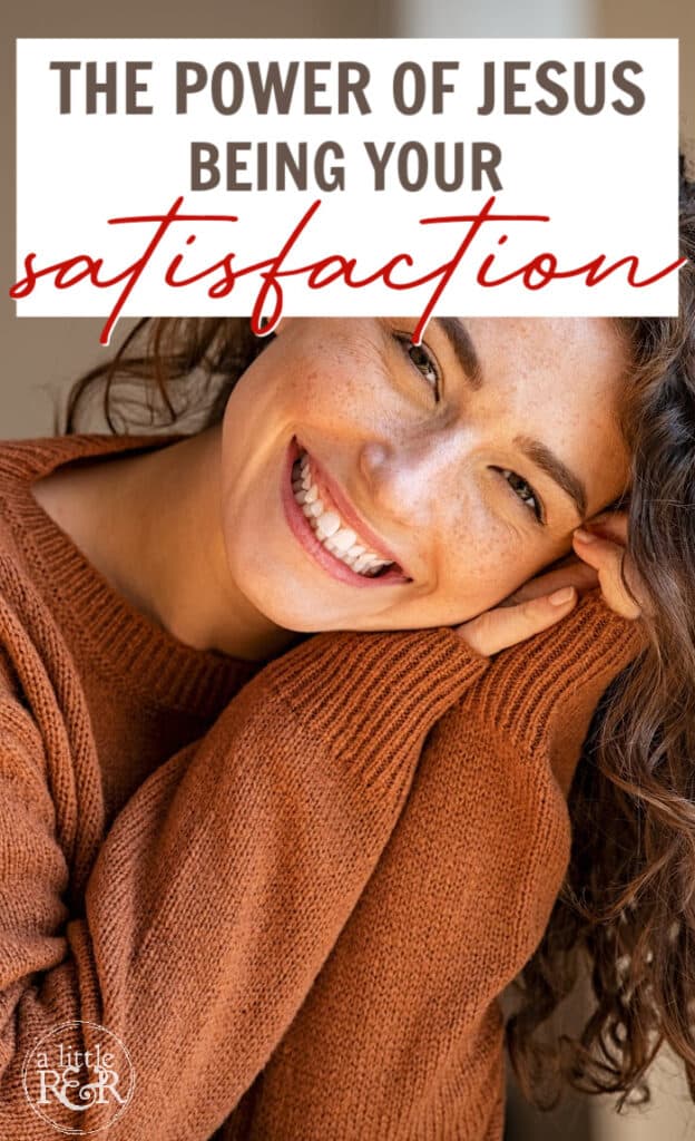 woman with a big smile in brown sweater