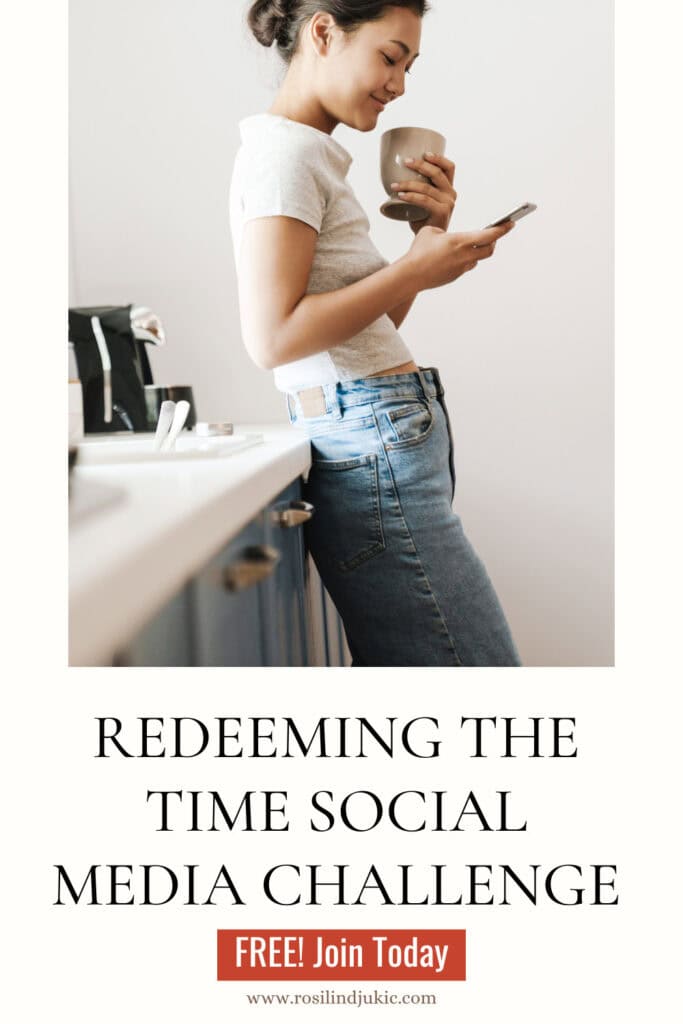 Woman leaning against kitchen sink looking at her phone