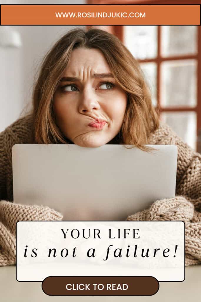 Woman feeling like a failure hugging a laptop