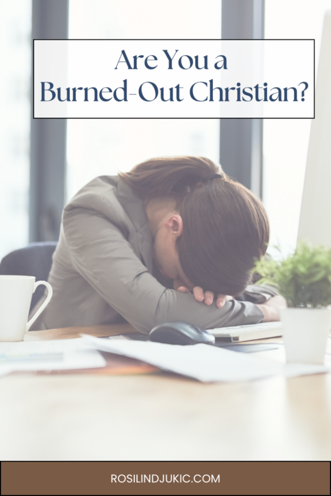 woman with head on desk because she's a burned out Christian
